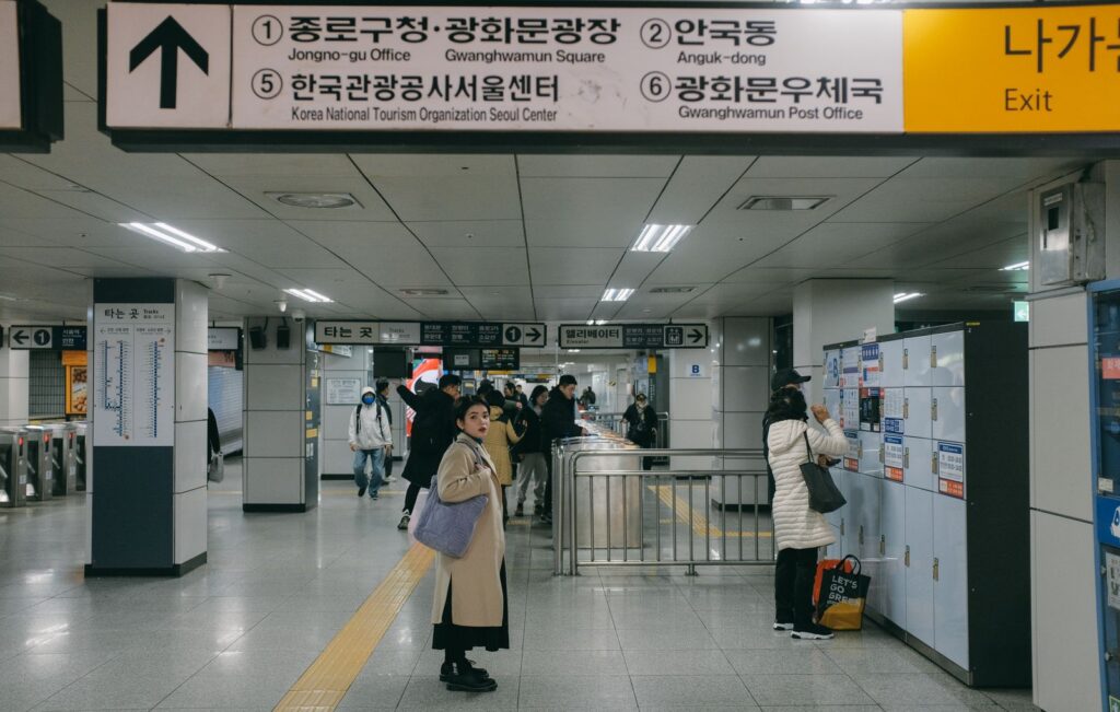 Getting Around Seoul: A First-Timer's Guide to the Subway, Buses & Taxis Passengers at a subway station in Seoul, the easiest way of getting around Seoul