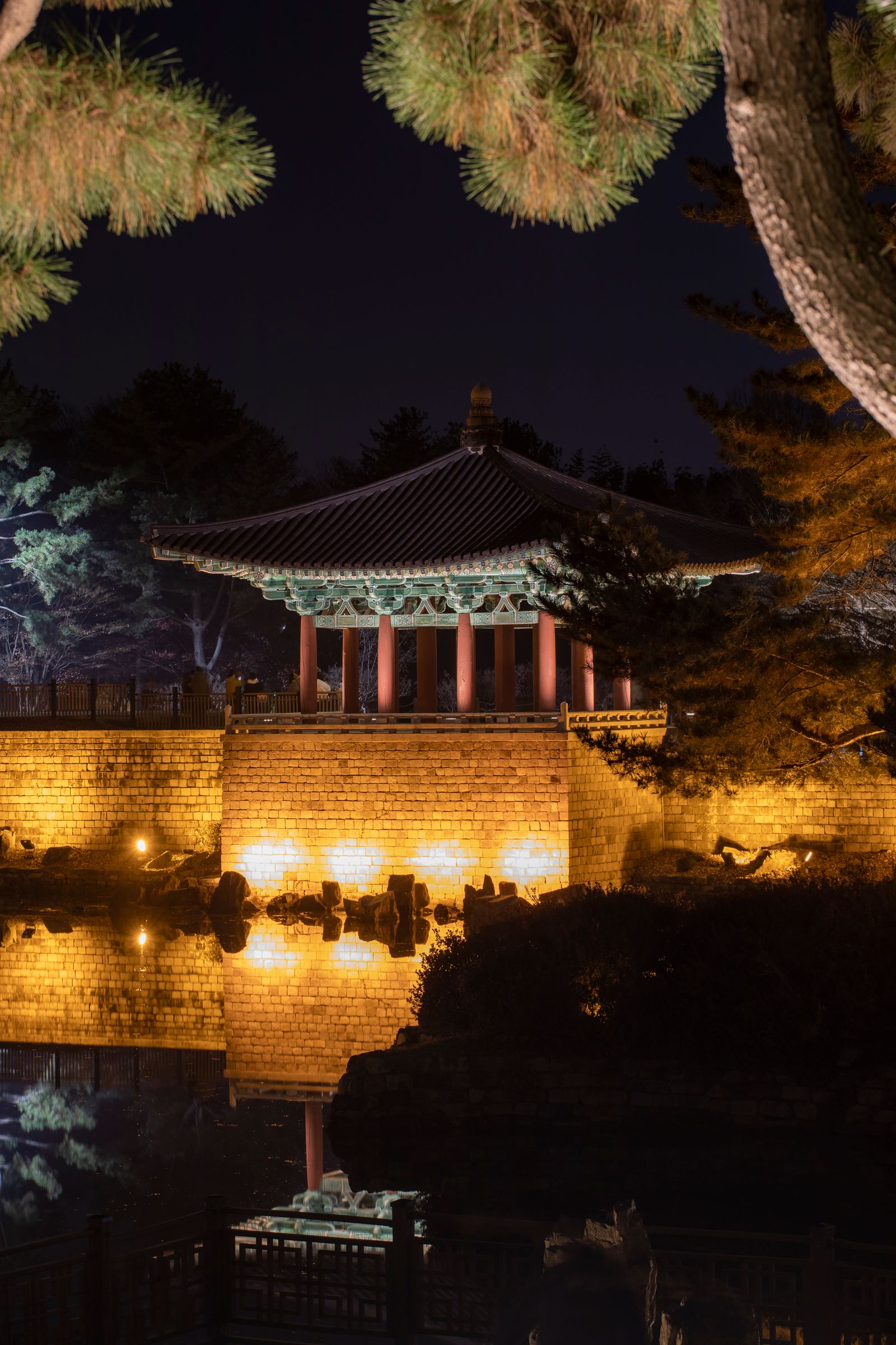Gyeongju Travel Guide: Korea's Ancient Capital, Temples & Where to Stay (2026) Donggung Palace pavilion floodlit at night and reflected in Wolji Pond, Gyeongju, South Korea