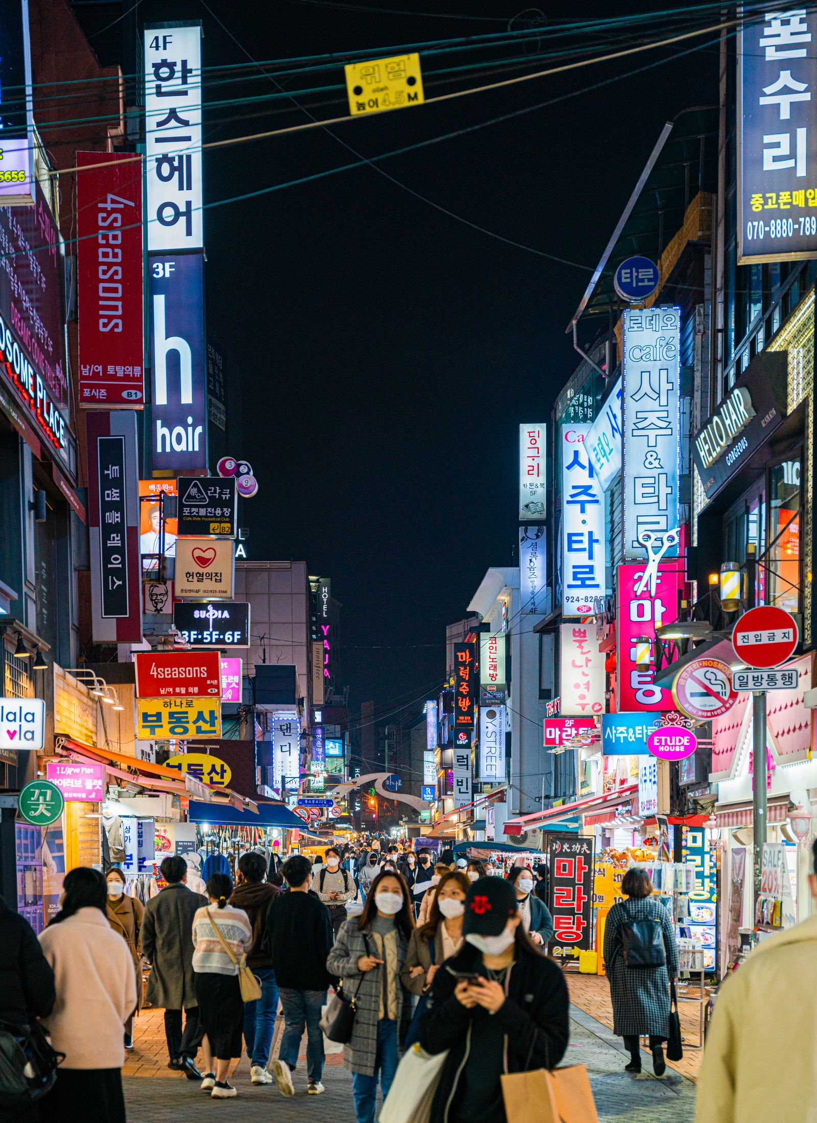 Itaewon, Seoul: Food, Bars & Where to Stay (2026) A busy night street with bars and restaurants in Itaewon, Seoul