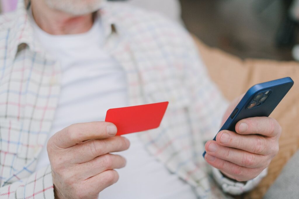 Korea SIM Card & eSIM: A Guide to Staying Connected (2026) Hands holding a SIM card and a smartphone, the essentials of a Korea SIM card setup