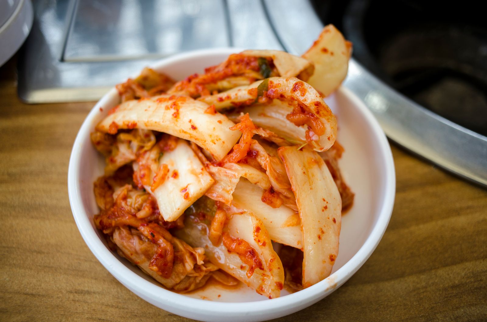 Korean BBQ in Seoul: What to Order & How to Grill (2026) A bowl of kimchi, a classic Korean BBQ side dish