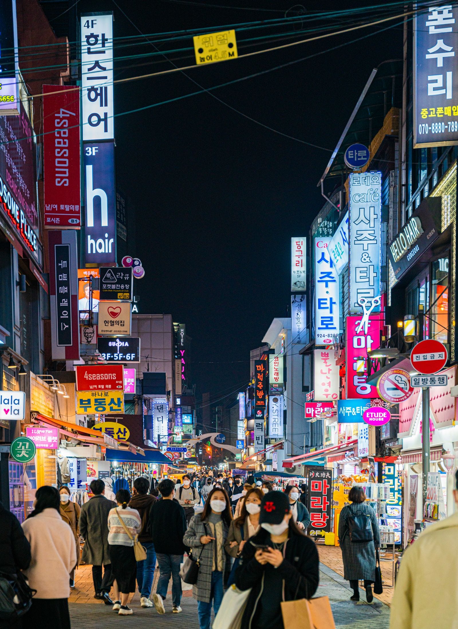 Nightlife in Seoul: Best Areas, Bars & Clubs (2026) A busy nightlife street at night in Seoul