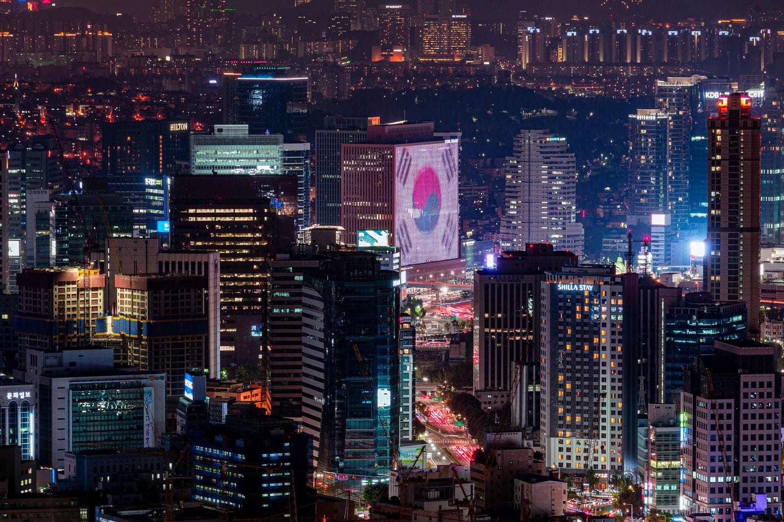 Nightlife in Seoul: Best Areas, Bars & Clubs (2026) A neon-lit street at night, the heart of nightlife in Seoul
