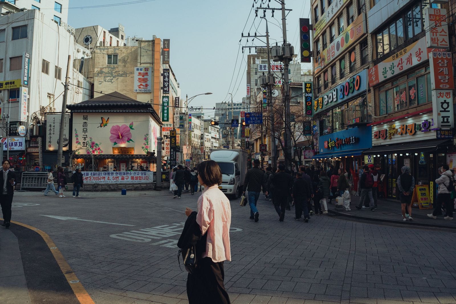 Seongsu-dong: A Guide to Seoul's Coolest Neighborhood (+ Where to Stay) A bustling Seoul street scene in spring