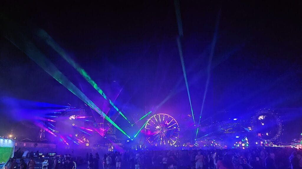 A ferris wheel lit up at night over the crowd at an Electric Daisy Carnival festival, the kind of scene EDC Korea 2026 brings to Incheon