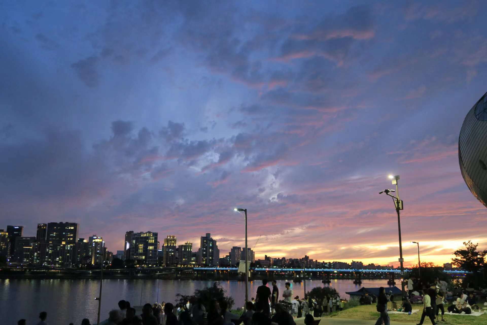 Han River park in Seoul lit up at night, the kind of riverside setting used for the drone light show