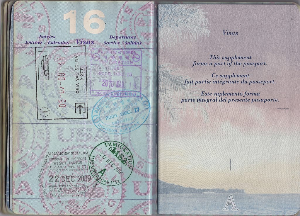 A passport with immigration entry stamps, including one from South Korea