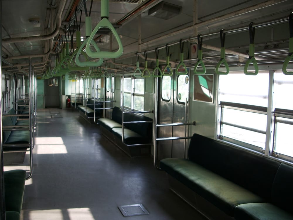 Interior of a Seoul subway train, where quiet voices and priority seating are part of the etiquette