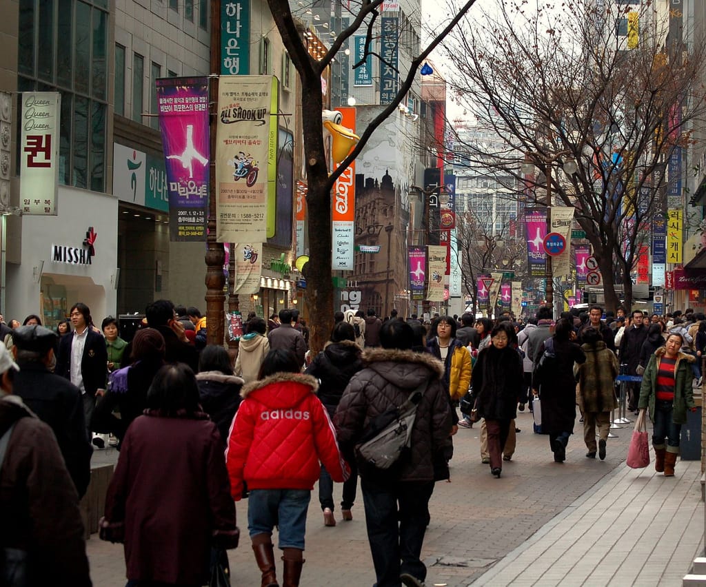 Shoppers on the pedestrianized main street of Myeongdong in Seoul
