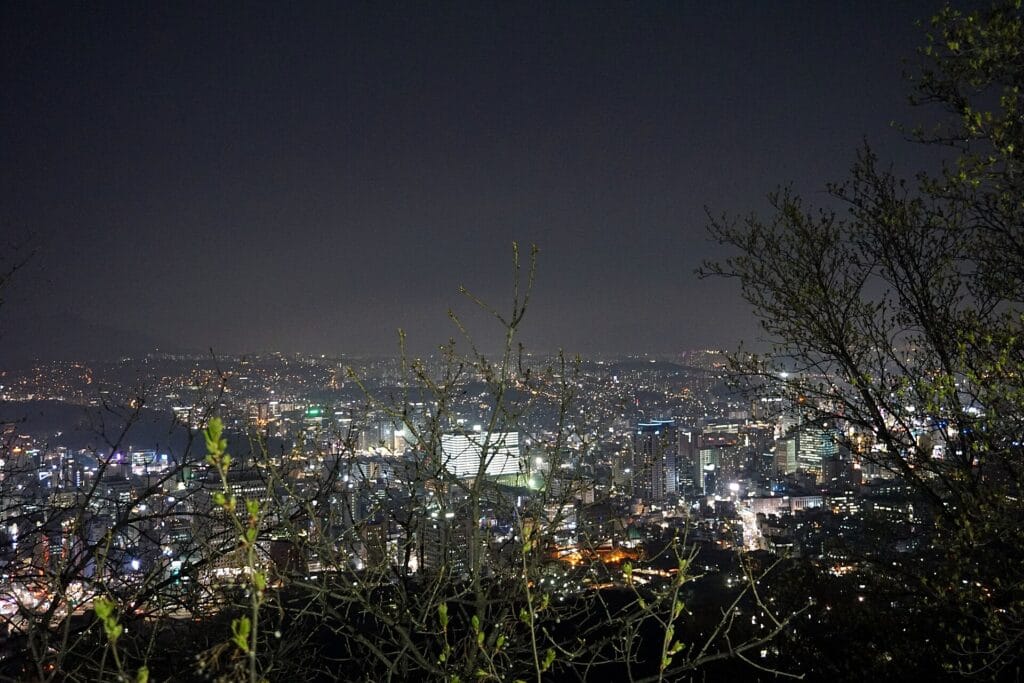 Seoul Neighborhoods Guide: Which Area Is Right for You? (2026) Seoul city skyline at night from Namsan, spread across the city's many neighborhoods