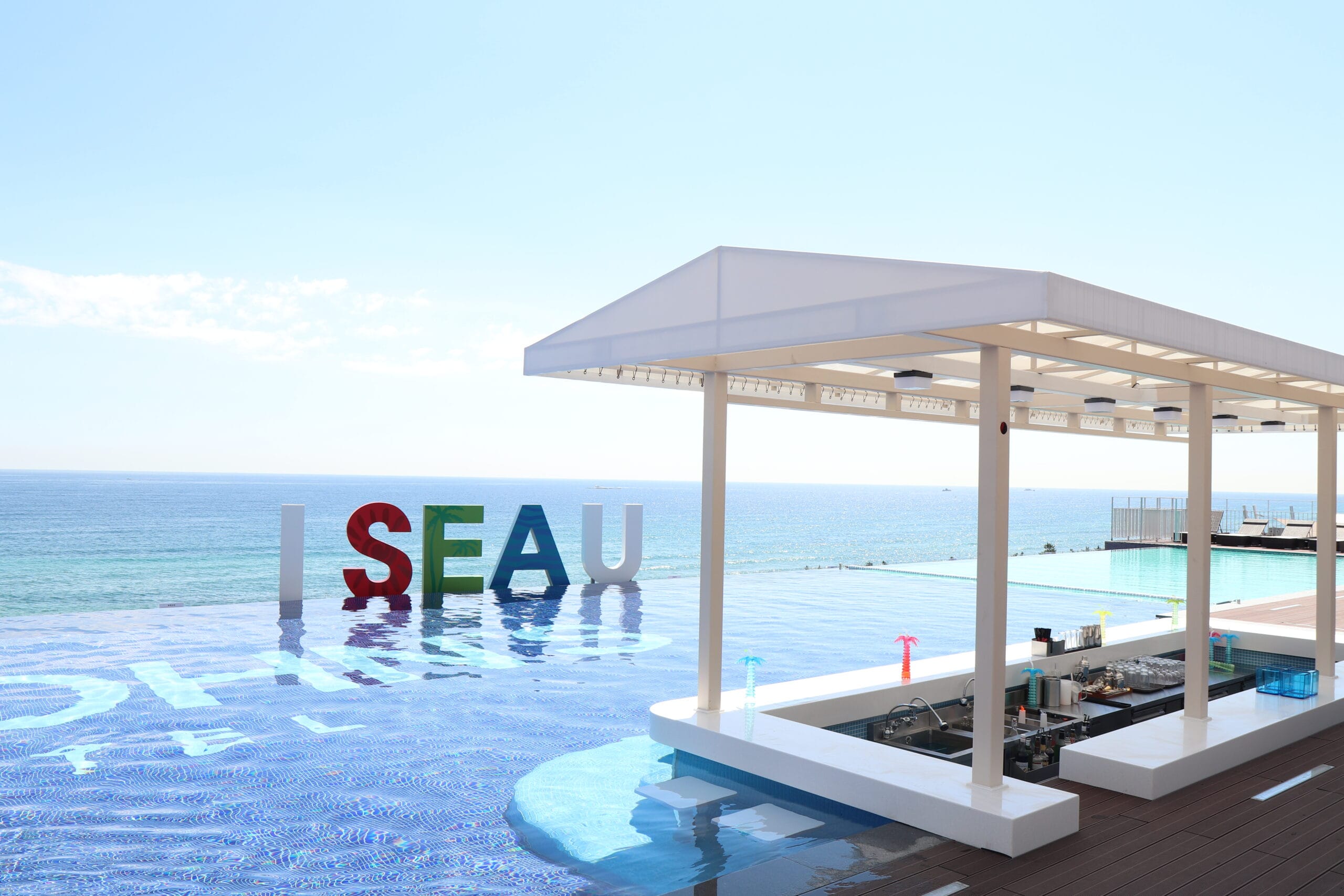 Where to Stay in Gangneung: Best Areas & Hotels for Every Trip (2026) St. John's Hotel facing Gangmun Beach in Gangneung, with its outdoor infinity pool