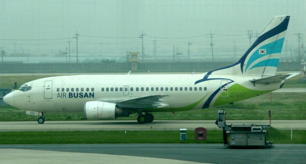 An Air Busan Boeing 737 taxiing at Gimhae International Airport, one of the three carriers in the Jin Air merger