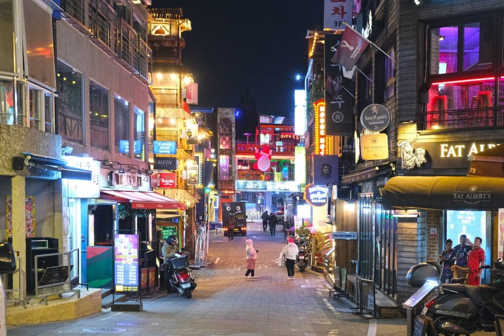 Where to Stay in Itaewon, Seoul: Best Hotels for Food & Nightlife (2026) A street lined with restaurants and bars in Itaewon, Seoul's most international neighborhood