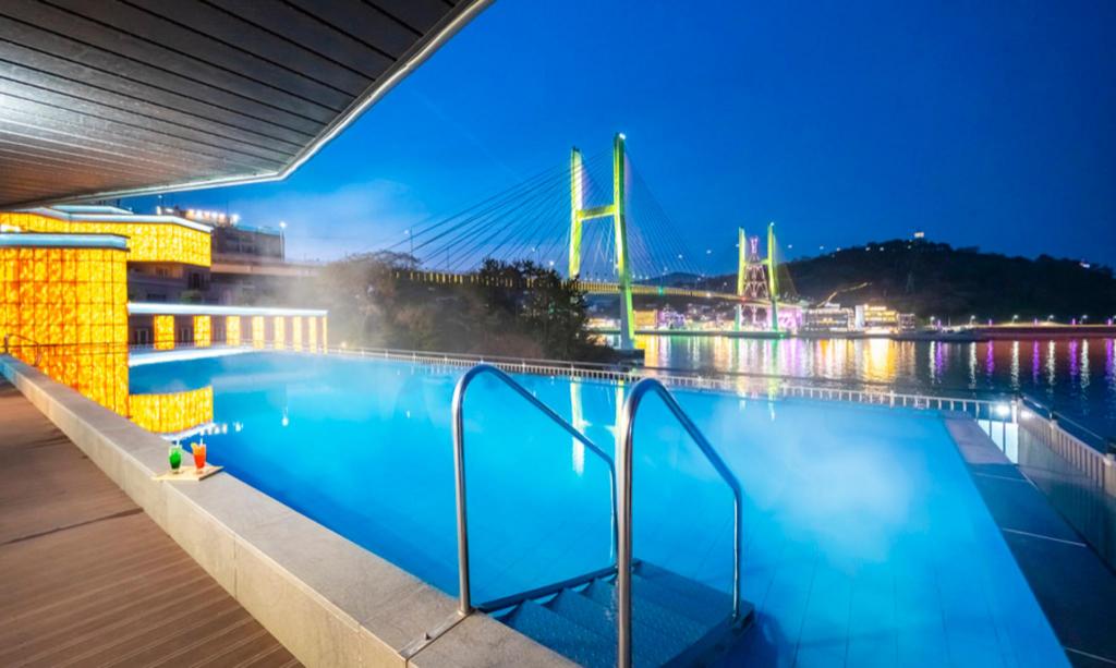 Where to Stay in Yeosu: Best Areas & Hotels for Every Trip (2026) The infinity pool at Hotel Haven in Yeosu, overlooking Odongdo Island at night