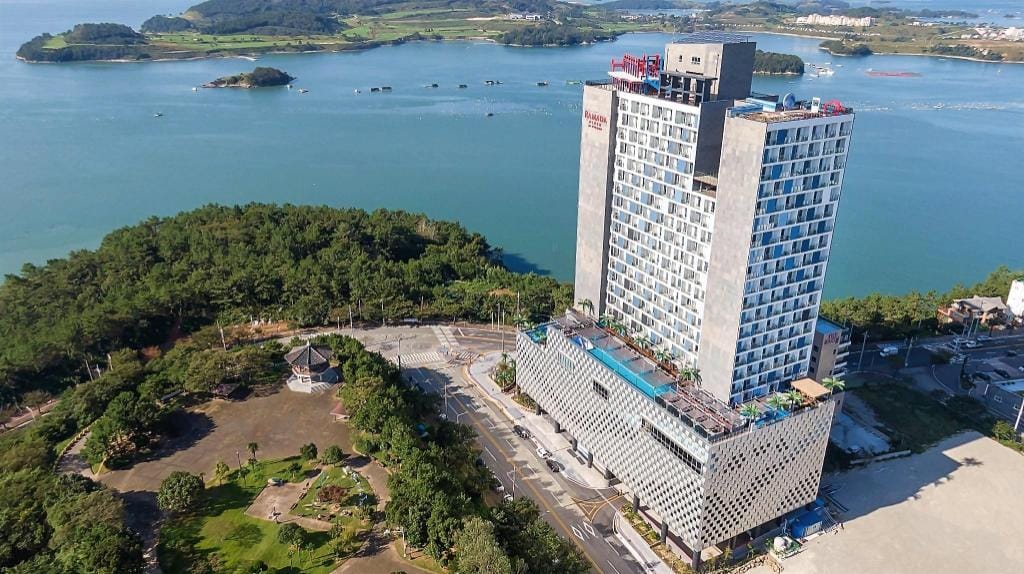 Where to Stay in Yeosu: Best Areas & Hotels for Every Trip (2026) An ocean-view room at Ramada Plaza by Wyndham Yeosu overlooking Dolsan Bridge
