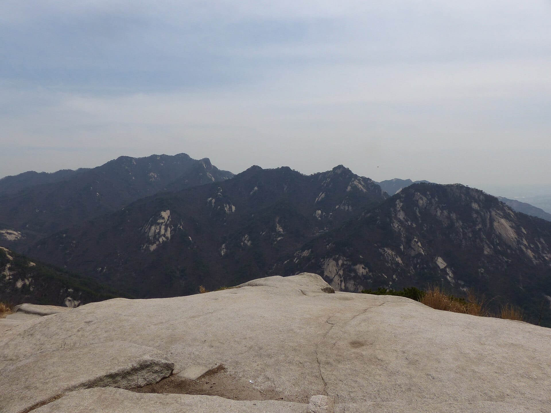 View across Bukhansan National Park's granite ridgelines from Wonhyobong peak