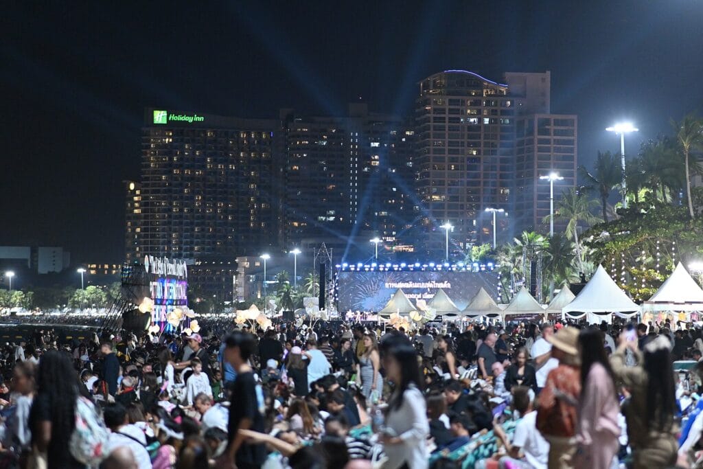 A large outdoor concert crowd at night facing a brightly lit stage, similar to the stadium-show setup expected for a large pop concert in Korea