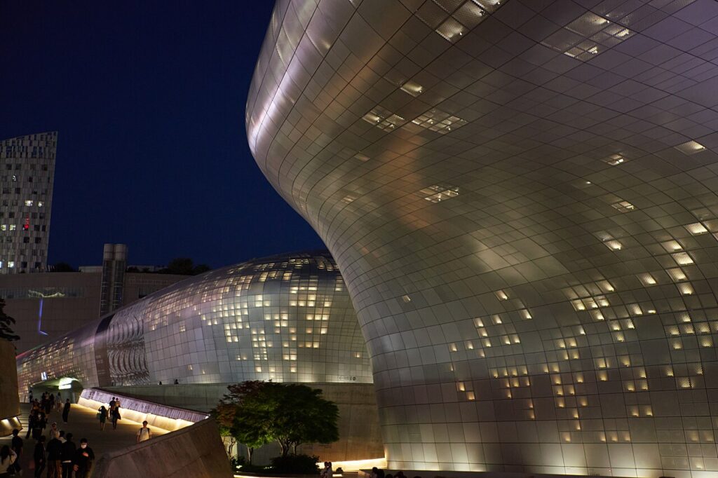The curved silver facade of Dongdaemun Design Plaza in Seoul, the base for Seoul Gourmet Week events